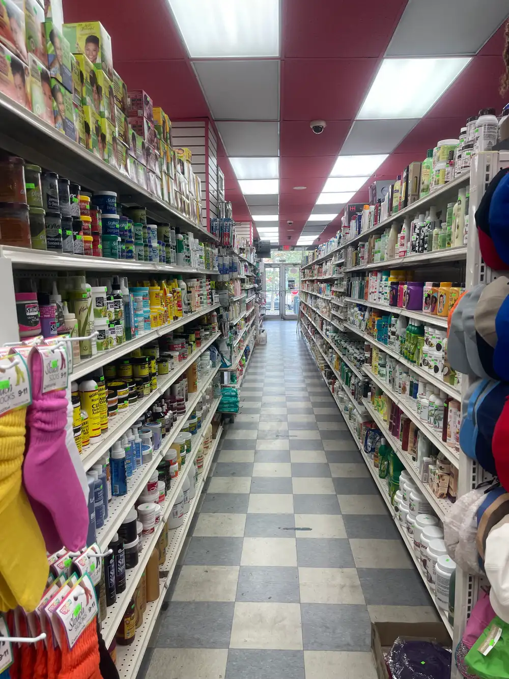 Hair care and treatment aisle inside Honey Beauty Supply in the Bronx