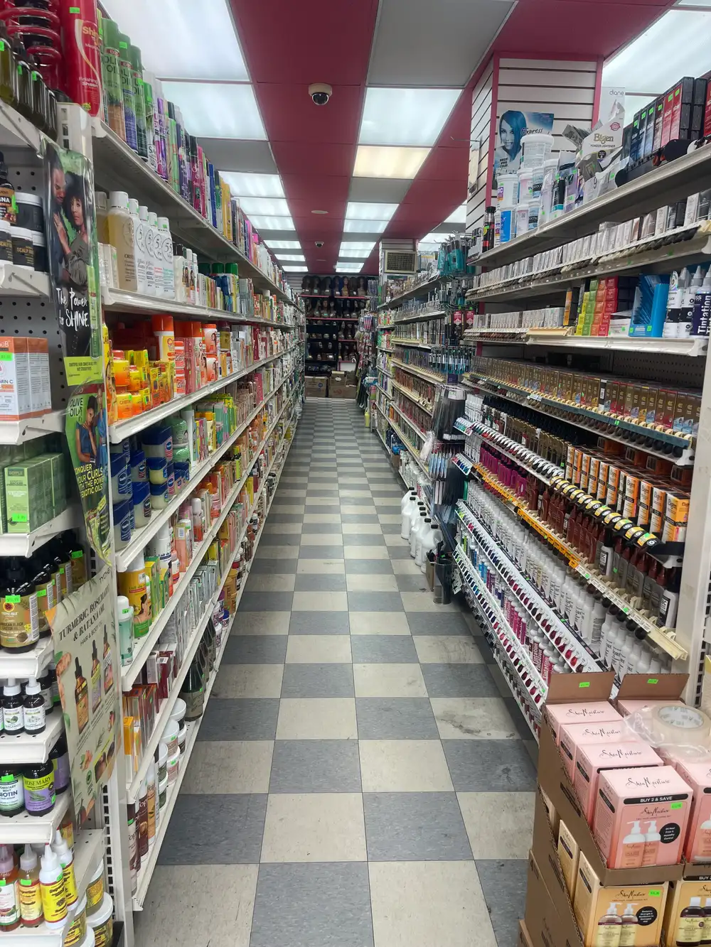 Nail polish and cosmetics wall at Honey Beauty Supply in Co-op City, Bronx